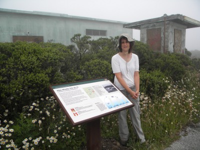 Brenda stands next to the sign at the IFC. The IFC is now part of Sweeney Ridge in the Golden Gate National Recreation Area.