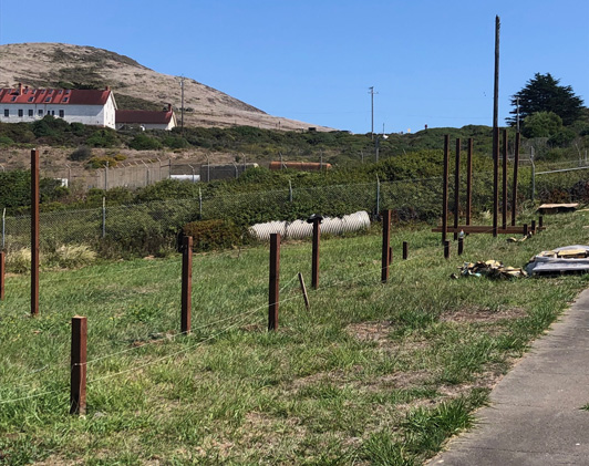 Concrete in the holes is holding the posts