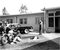 Off duty soldiers work on their motor vehicles at LA94 in the 1960's